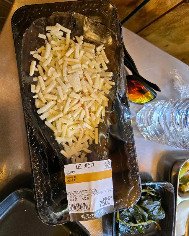 푸짐하게 올라간 치즈가 먹음직스러운 가리비